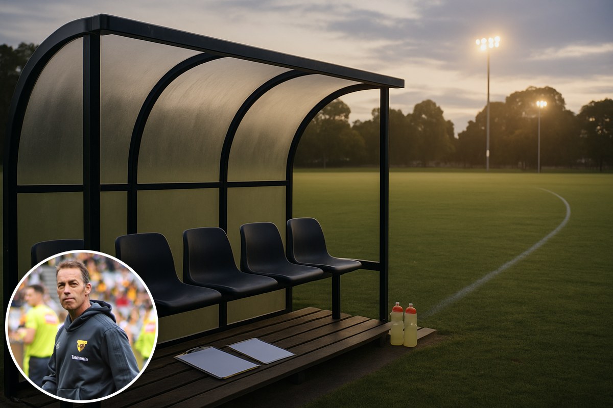 An empty coaches' bench beside a football oval at dusk under floodlights, with an inset photo of Alastair Clarkson.